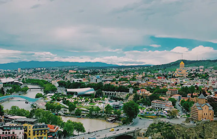 Tbilisi rooftops, the Mtkvari River and Holy Trinity Cathedral in Georgia