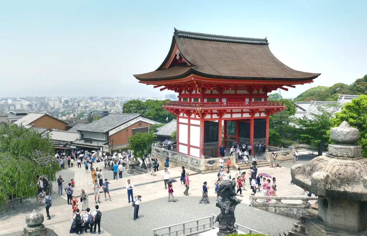 Temple buildings and a green hillside at Kiyomizu-dera in Kyoto, Japan