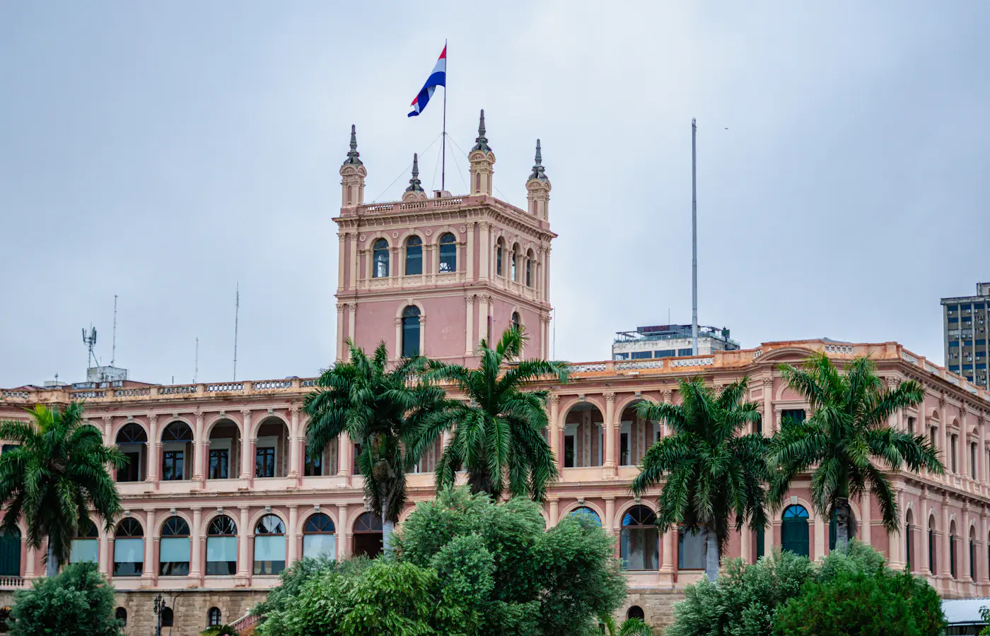 Pink facade and tower of the Palacio de los López palace in Asunción, Paraguay
